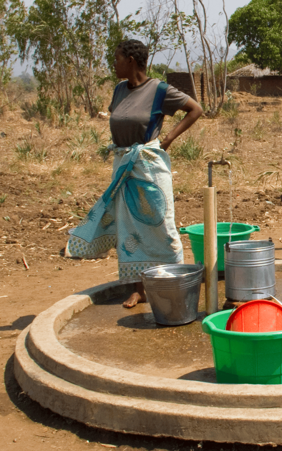 A person collecting water related data in the field.